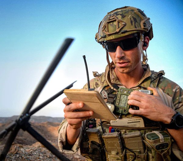 armed forces personnel reading notes off a notepad