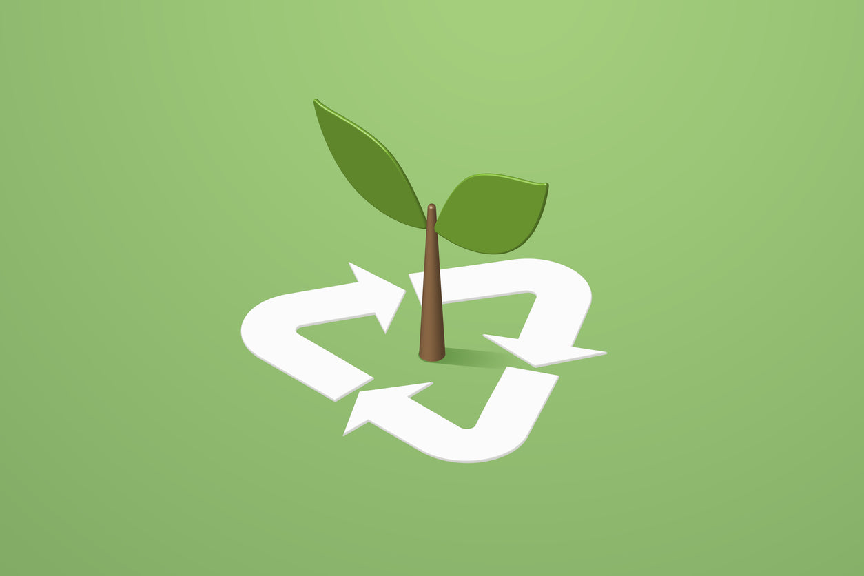 recycling symbol with tree on a green background